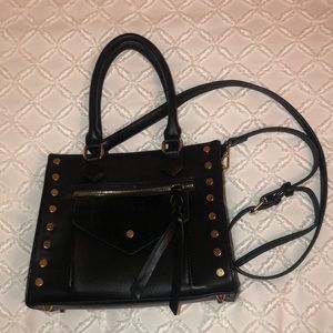 Faux leather shoulder bag with gold hardware.